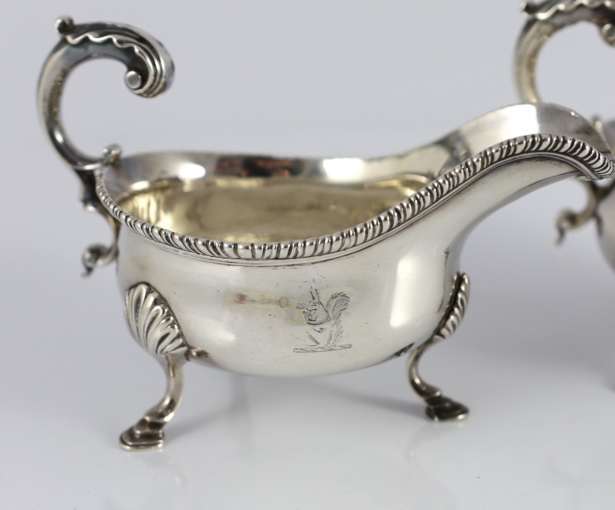 A near pair of George III silver sauceboats